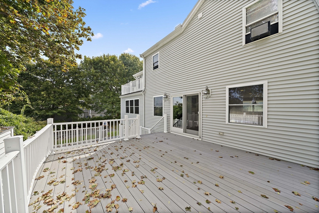 92 Spring Street Quincy, MA 02169 - Photo 24 of 34 a view of a house with a wooden deck