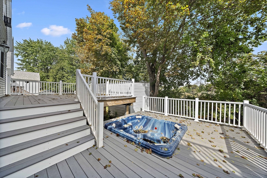 92 Spring Street Quincy, MA 02169 - Photo 25 of 34 a view of balcony with wooden floor and fence