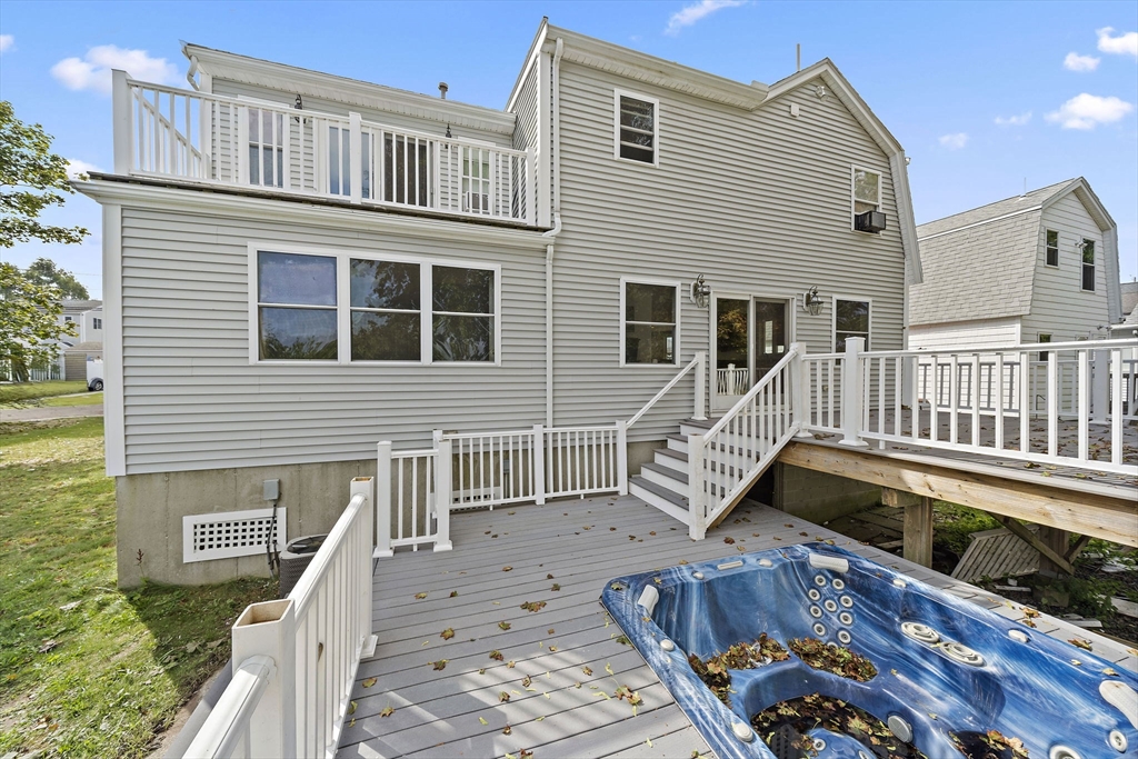 92 Spring Street Quincy, MA 02169 - Photo 26 of 34 a view of a house with wooden deck