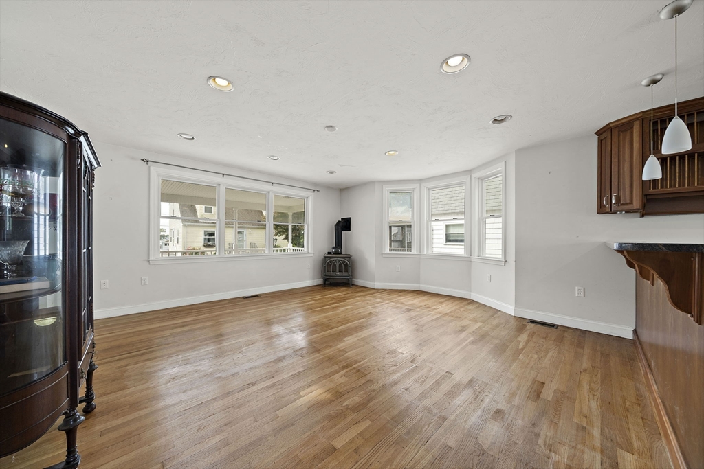 92 Spring Street Quincy, MA 02169 - Photo 9 of 34 a view of empty room with wooden floor and fan