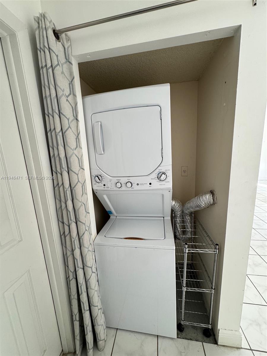 13705 Southwest 149th Cir Lane, Unit 157 Miami, FL 33186 - Photo 12 of 19 a utility room with dryer and washer