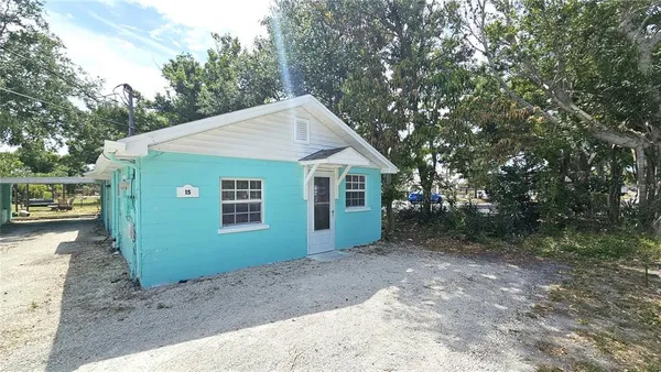 a view of a house with a backyard space