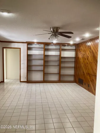 a kitchen with kitchen island granite countertop stainless steel appliances a sink stove and cabinets
