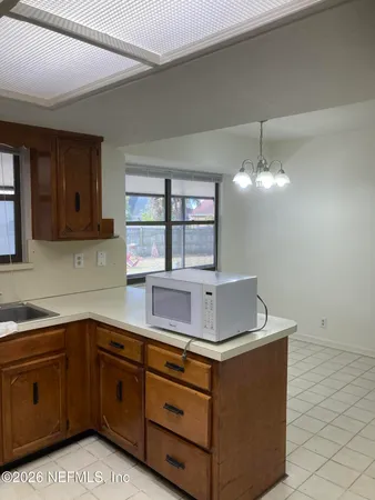 a kitchen with stainless steel appliances granite countertop a sink and a stove