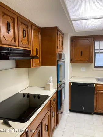 a view of a room with a ceiling fan