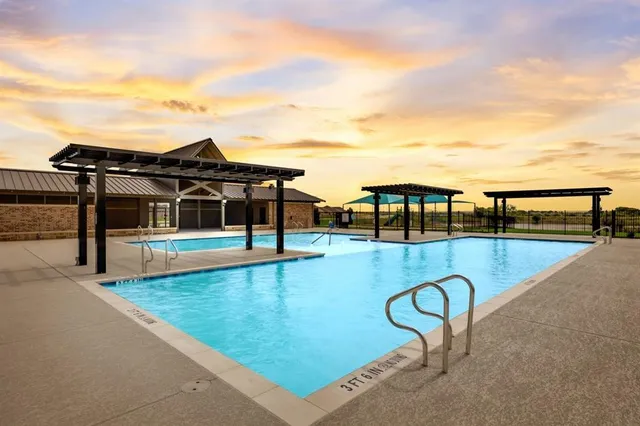 a swimming pool with view of lake