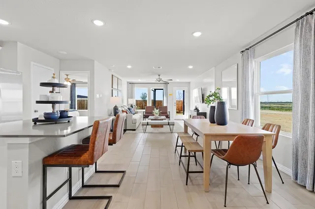 a view of a dining room with furniture window and outside view