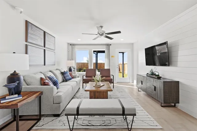 a living room with furniture and a flat screen tv