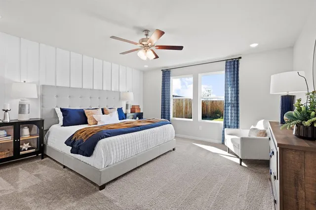 a bed room with a bed and a chandelier