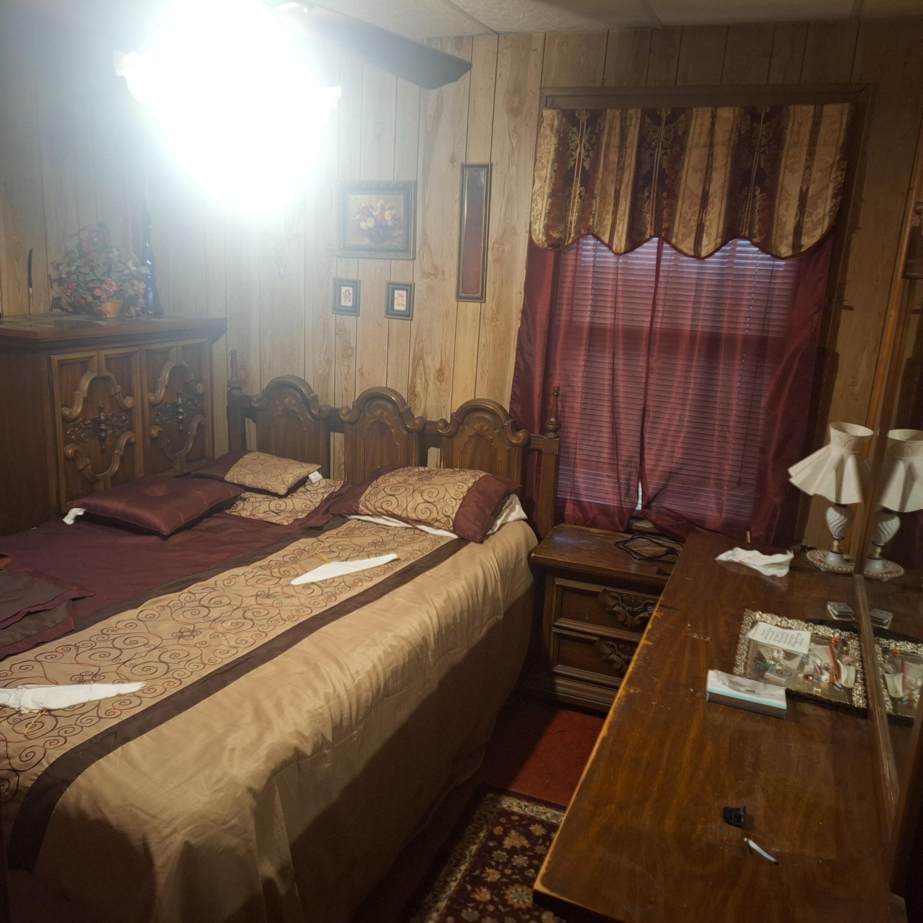 1165 Harrison Street Gary, IN 46407 - Photo 6 of 7 a bedroom with a bed and wooden floor