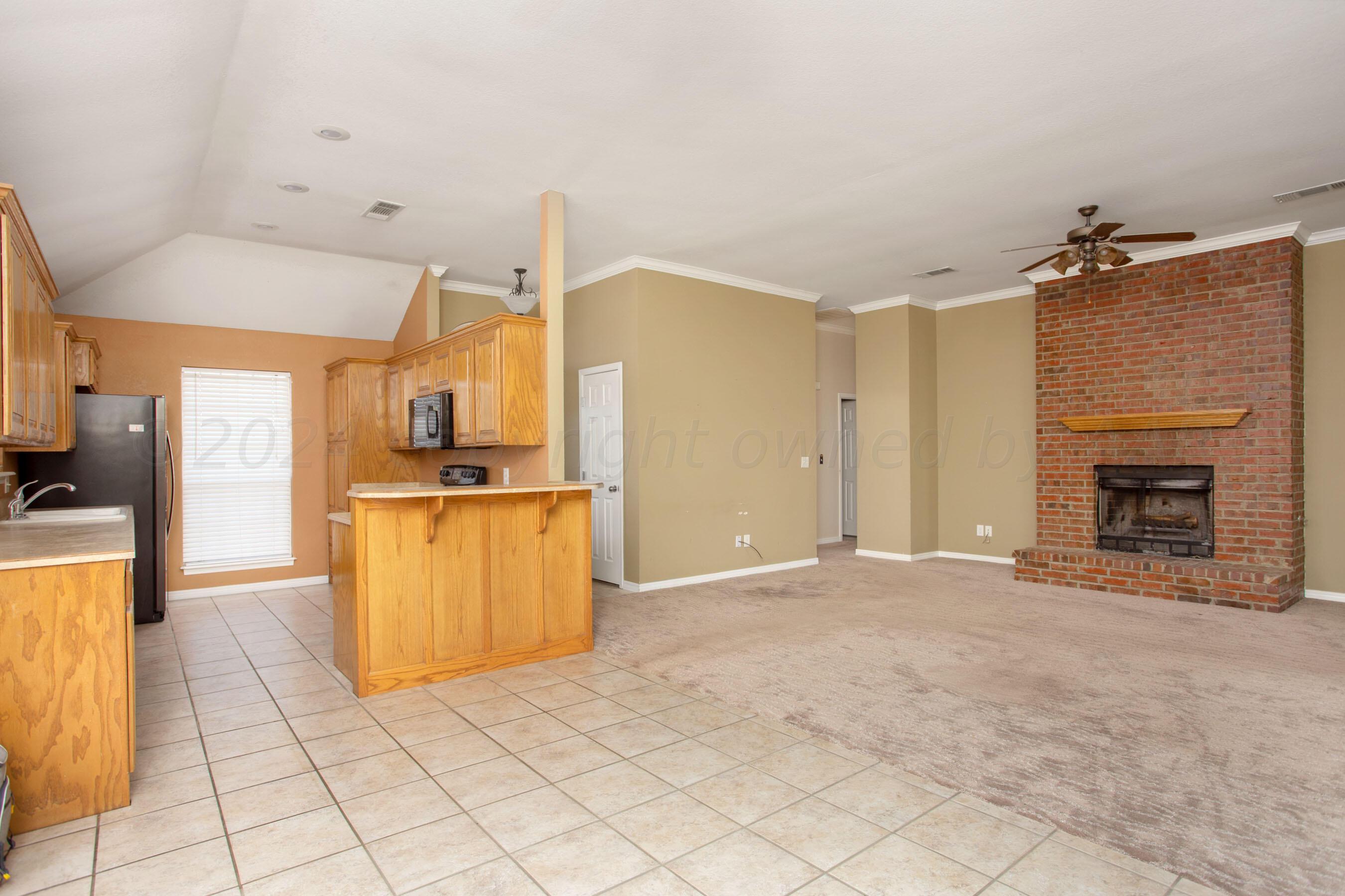 19701 Prairie Wind Road Bushland, TX 79124 - Photo 7 of 34 Dining/Kitchen into Living Area