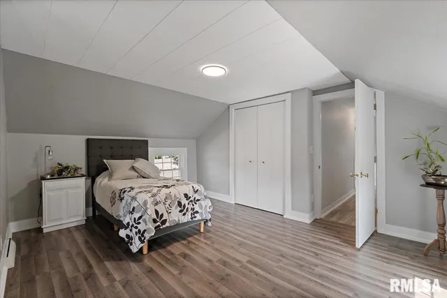 a bedroom with furniture and a window