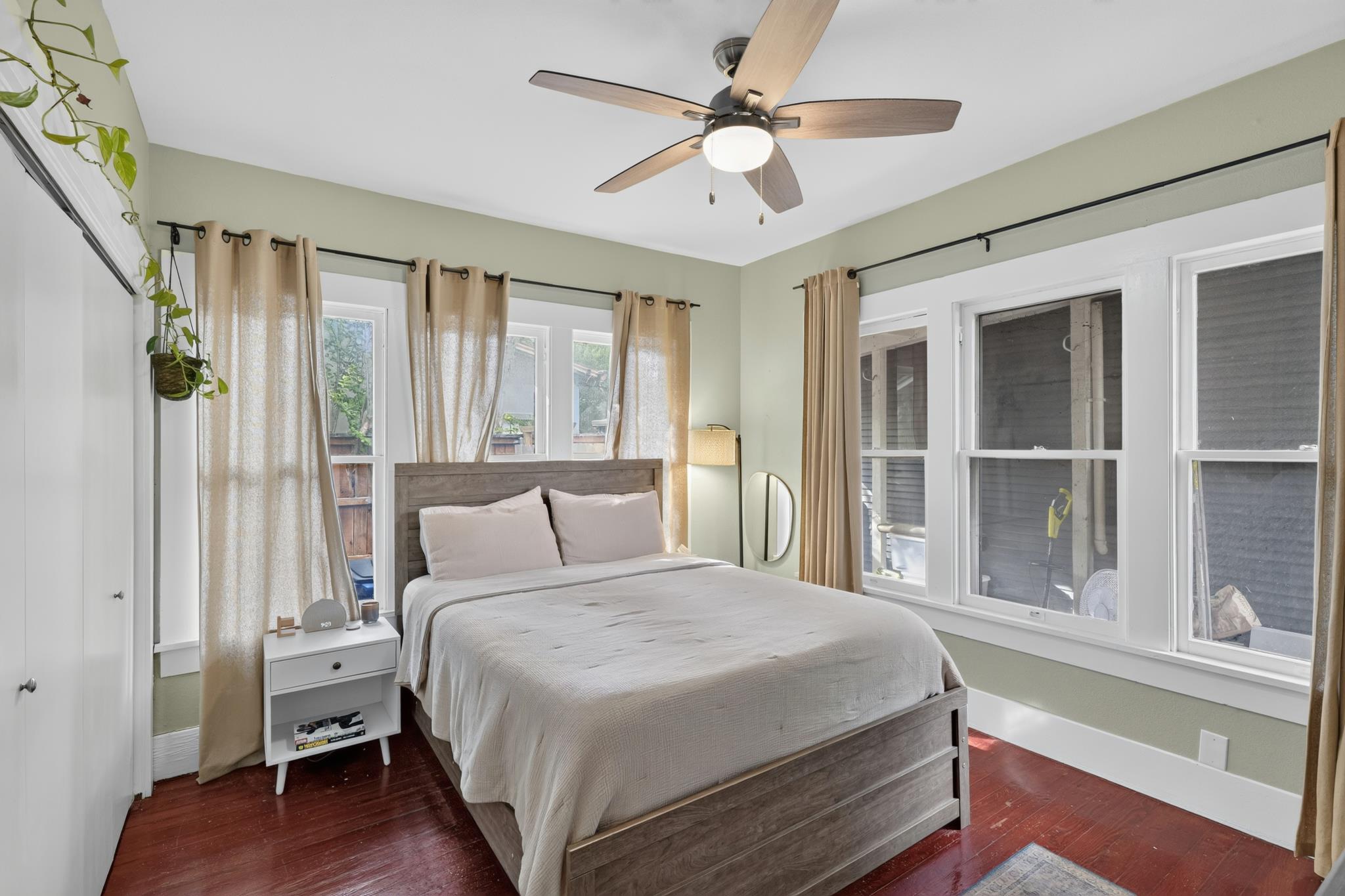 307 East 35th Street, Unit A Austin, TX 78705 - Photo 25 of 40 Rich hardwood floors complement a neutral palette in this peaceful sleeping retreat.