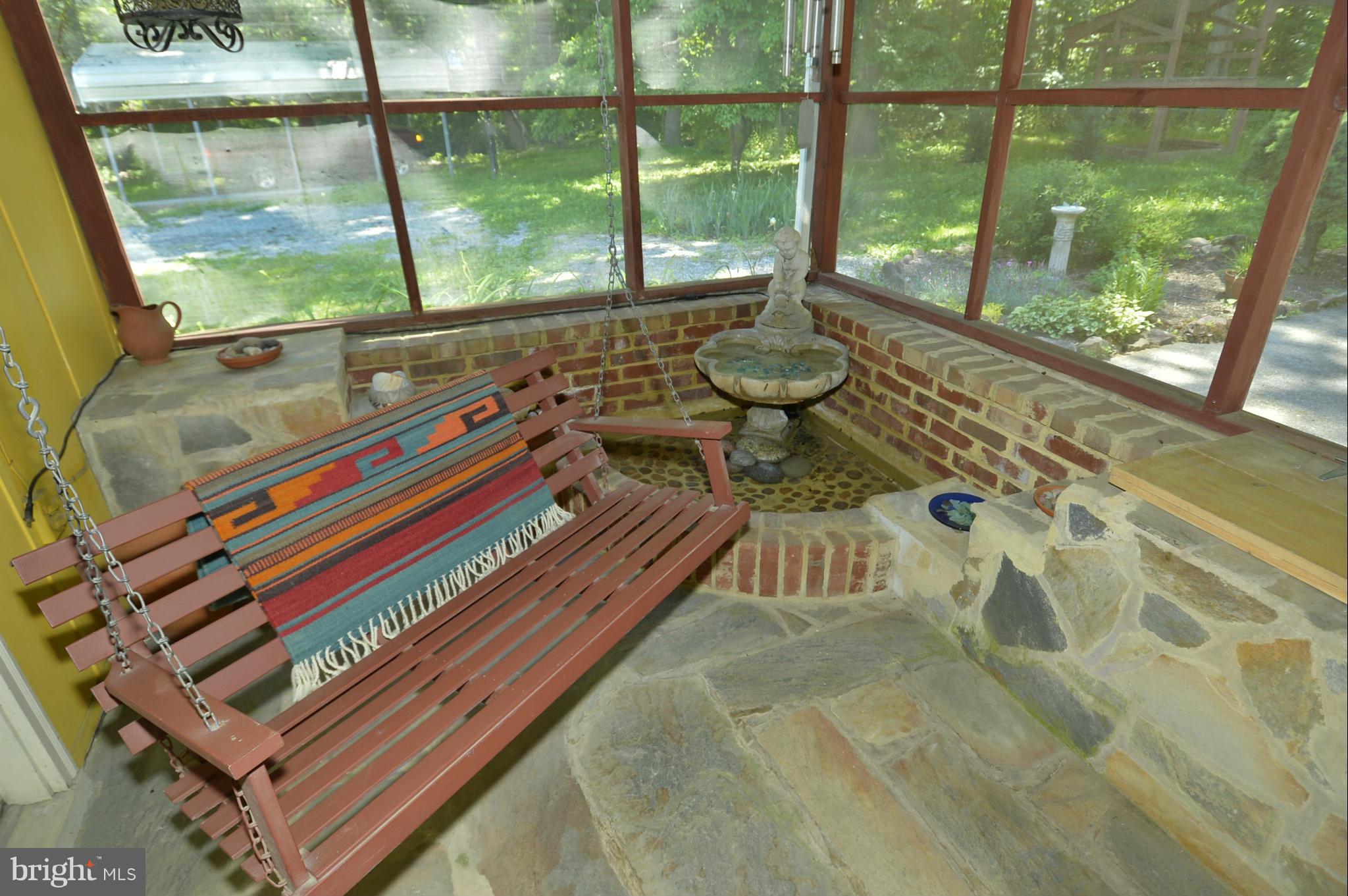 6446 Howellsville Road Front Royal, VA 22630 - Photo 12 of 30 a living room with a bed and a large window