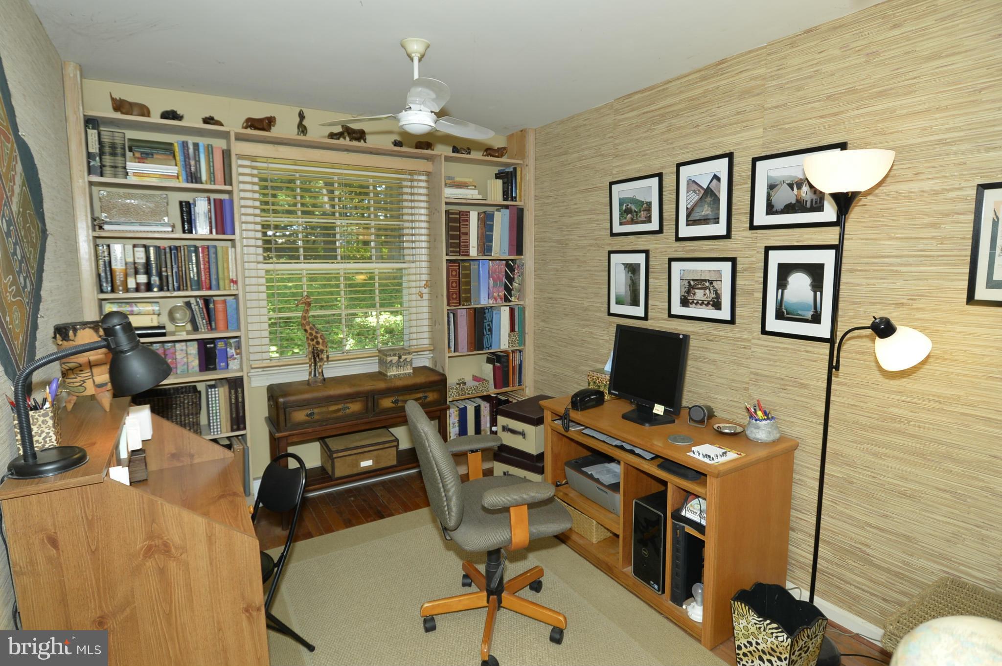 6446 Howellsville Road Front Royal, VA 22630 - Photo 25 of 30 a view of a workspace with furniture and a window