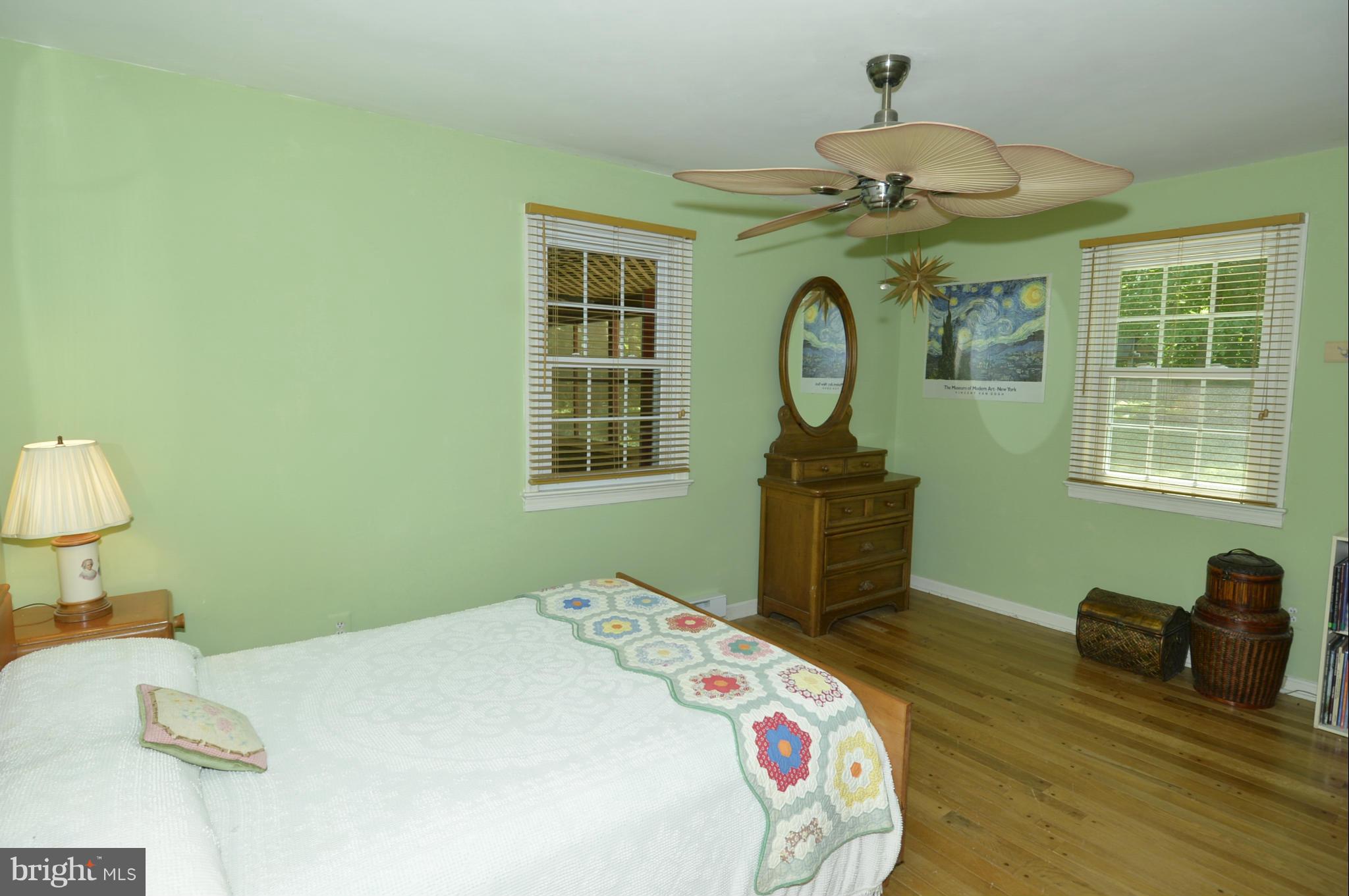 6446 Howellsville Road Front Royal, VA 22630 - Photo 28 of 30 a bedroom with a bed and a chandelier