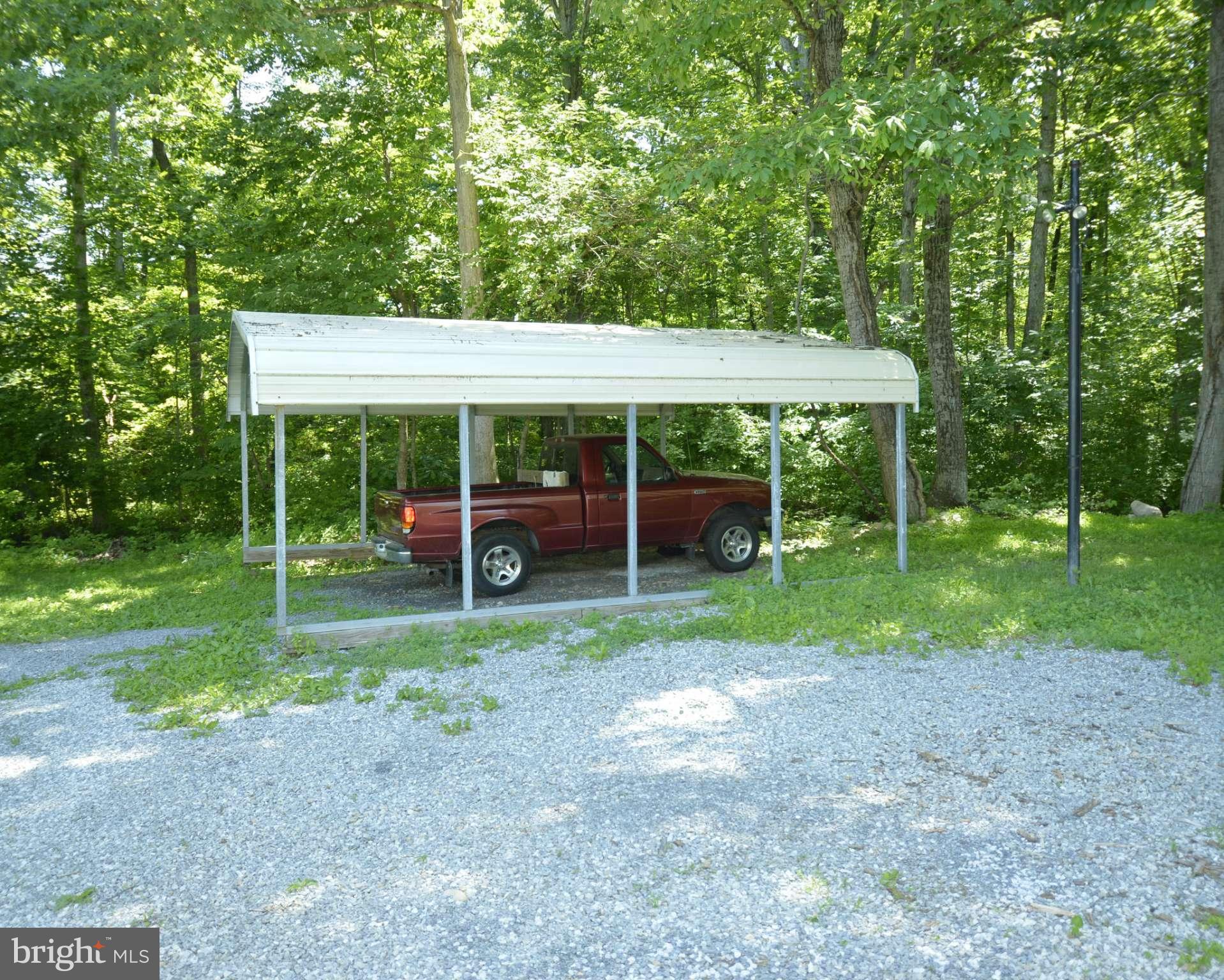 6446 Howellsville Road Front Royal, VA 22630 - Photo 6 of 30 a view of a house with backyard sitting area and garden