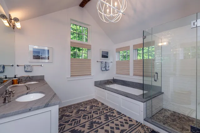 a spacious bedroom with a bed and window