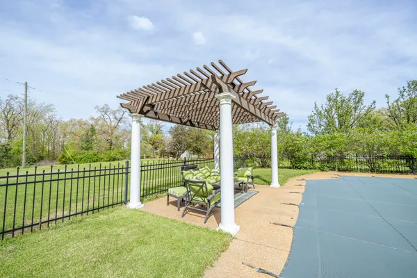 a view of a deck with a big yard