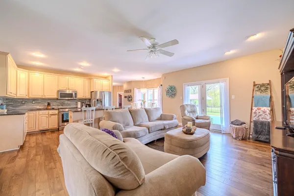 a living room with furniture and a large window
