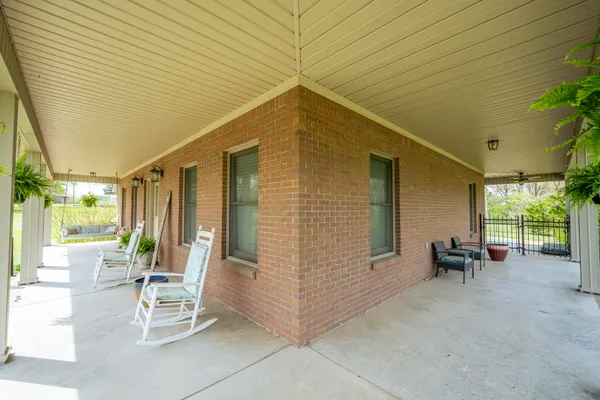 a view of an outdoor space with porch and patio