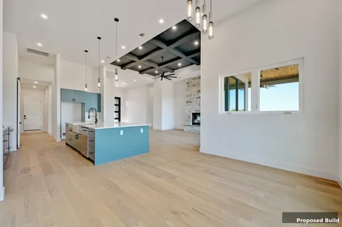 a large kitchen with stainless steel appliances kitchen island a large counter space a sink and cabinets