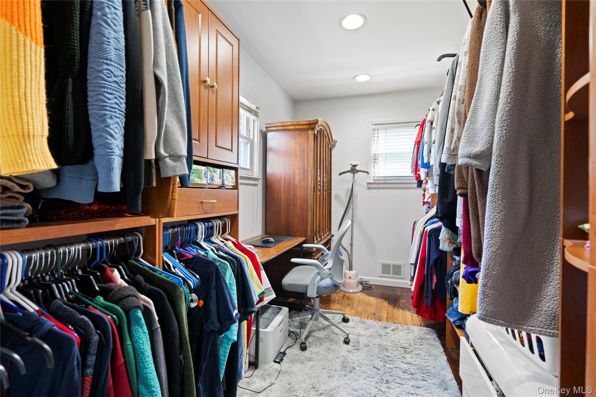 304 Unqua Road Massapequa, NY 11758 - Photo 14 of 26 a view of walk in closet with clothes