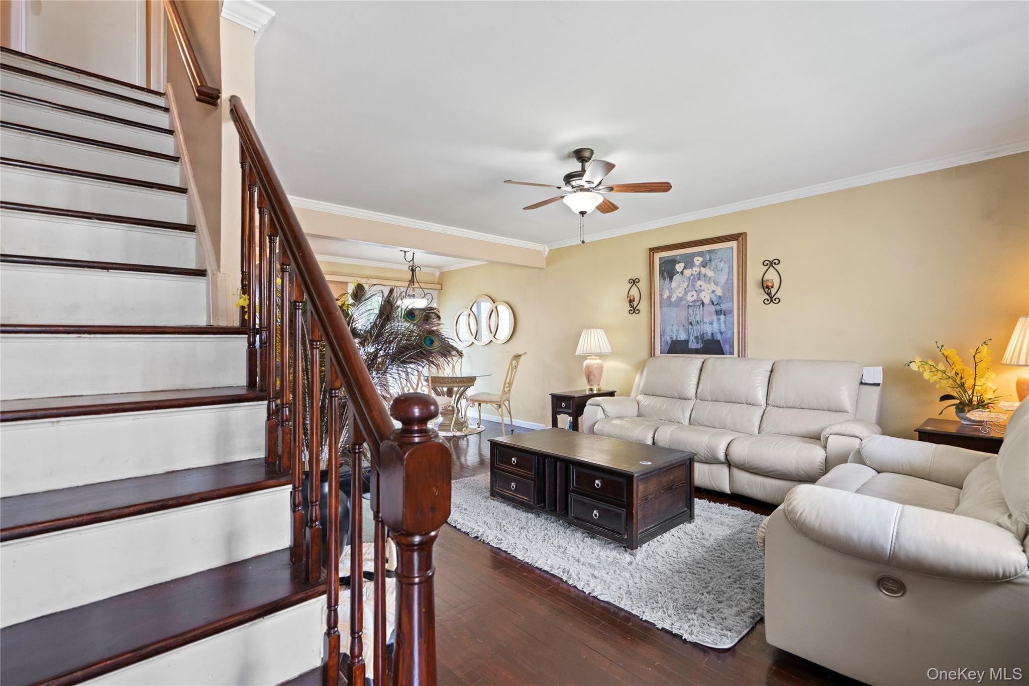 304 Unqua Road Massapequa, NY 11758 - Photo 4 of 26 a living room with furniture and wooden floor