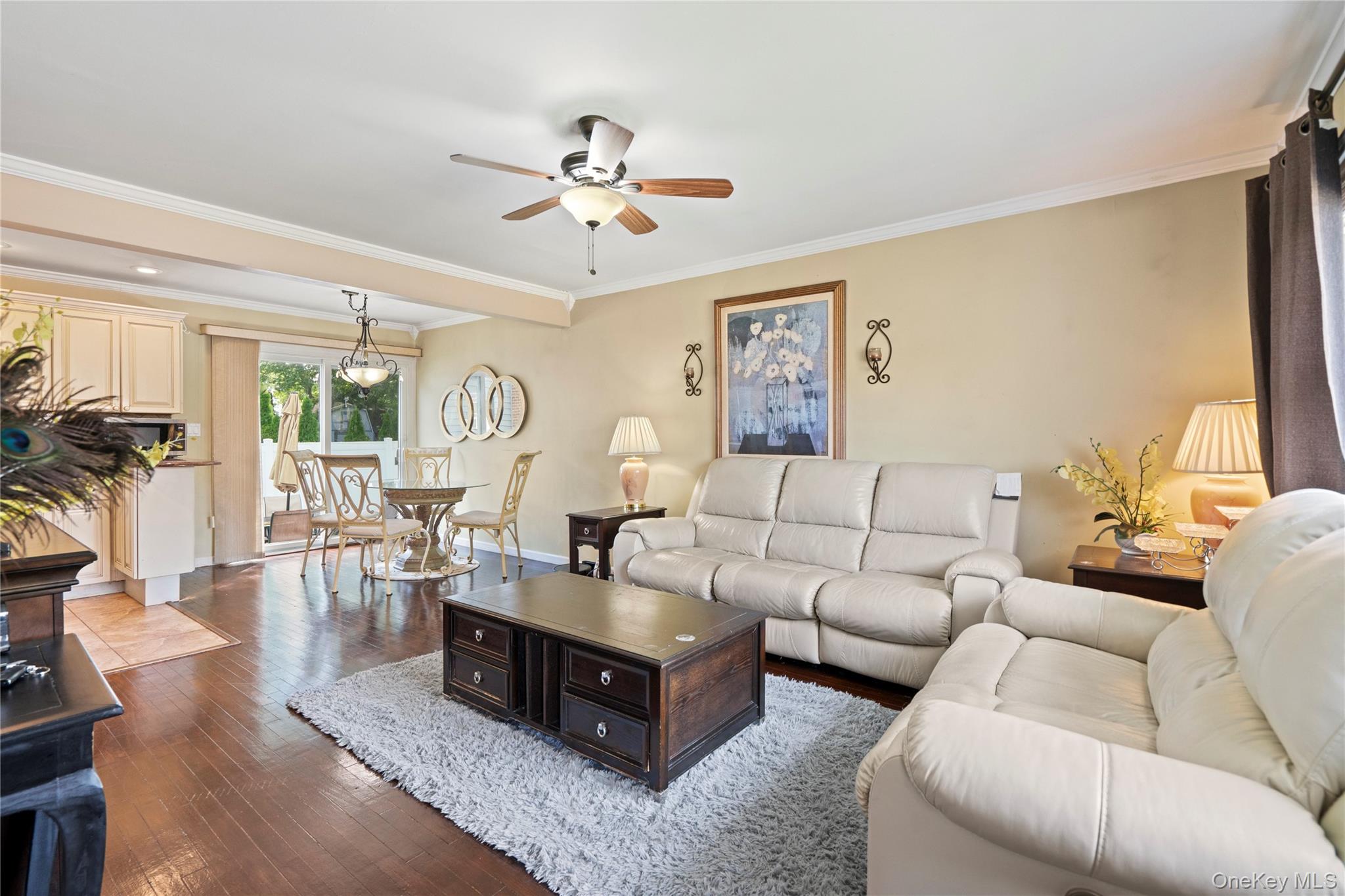 304 Unqua Road Massapequa, NY 11758 - Photo 5 of 26 a living room with furniture and a large window