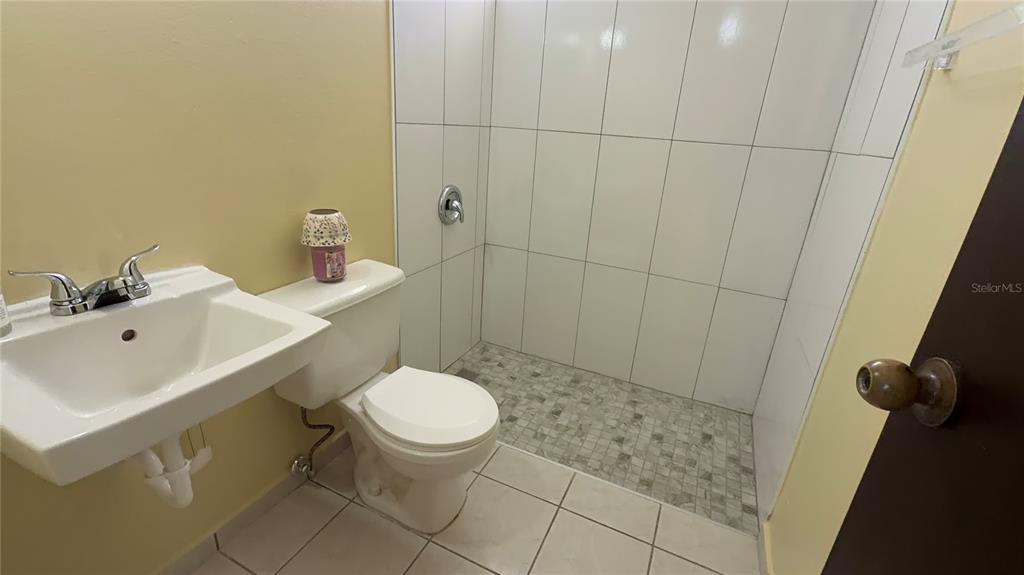 1 St Rio Grande, Unit B6 Rio Grande, PR 00745 - Photo 42 of 47 a bathroom with a sink toilet and shower