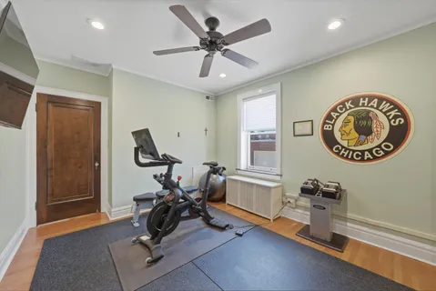 a living room with furniture hard wood floor and a fireplace