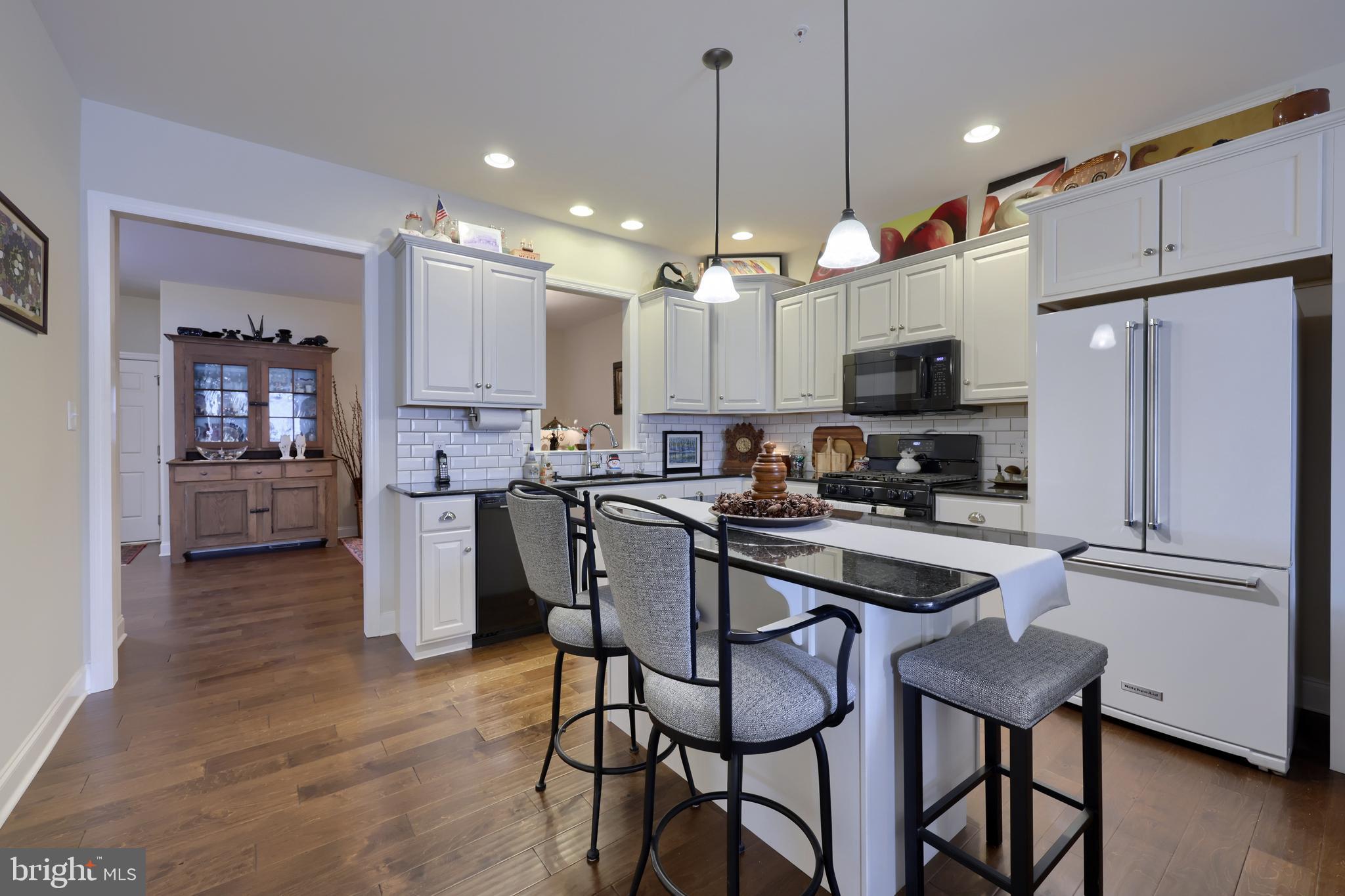 364 Pin Oak Drive Lititz, PA 17543 - Photo 16 of 39 a kitchen with kitchen island white cabinets and stainless steel appliances