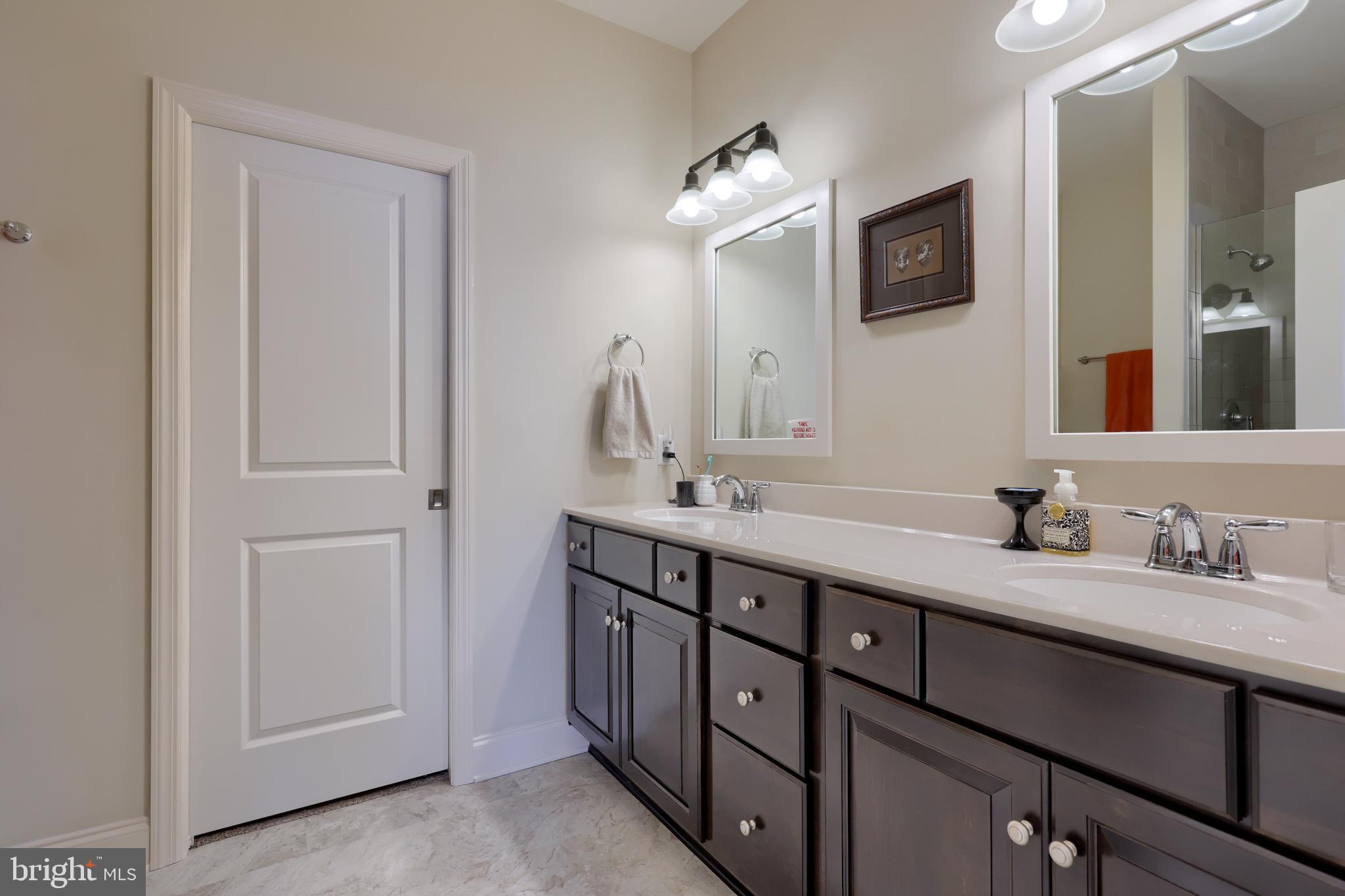 364 Pin Oak Drive Lititz, PA 17543 - Photo 27 of 39 a bathroom with a double vanity sink and a mirror
