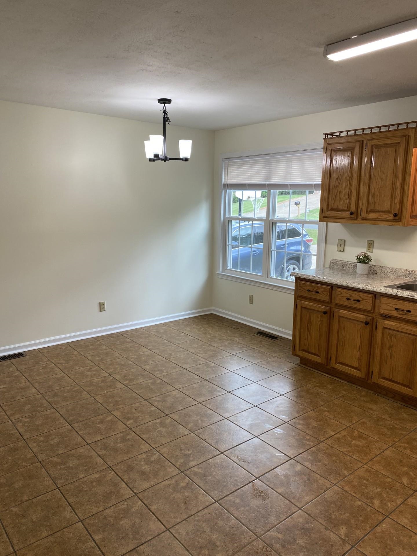 81 Candlewick Drive Jackson, TN 38305 - Photo 14 of 30 a kitchen with stainless steel appliances a sink stove and cabinets