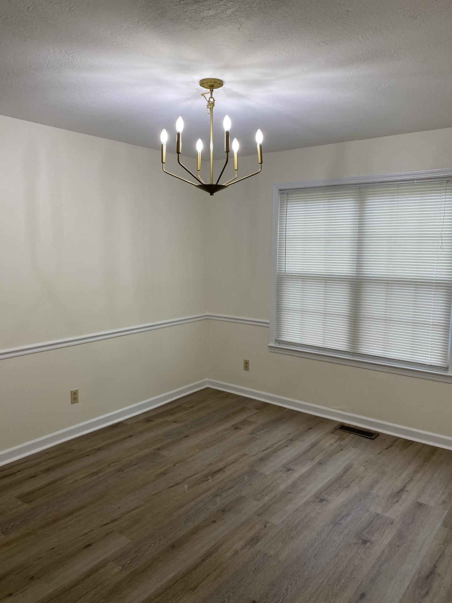 81 Candlewick Drive Jackson, TN 38305 - Photo 15 of 30 wooden floor in an empty room with a window