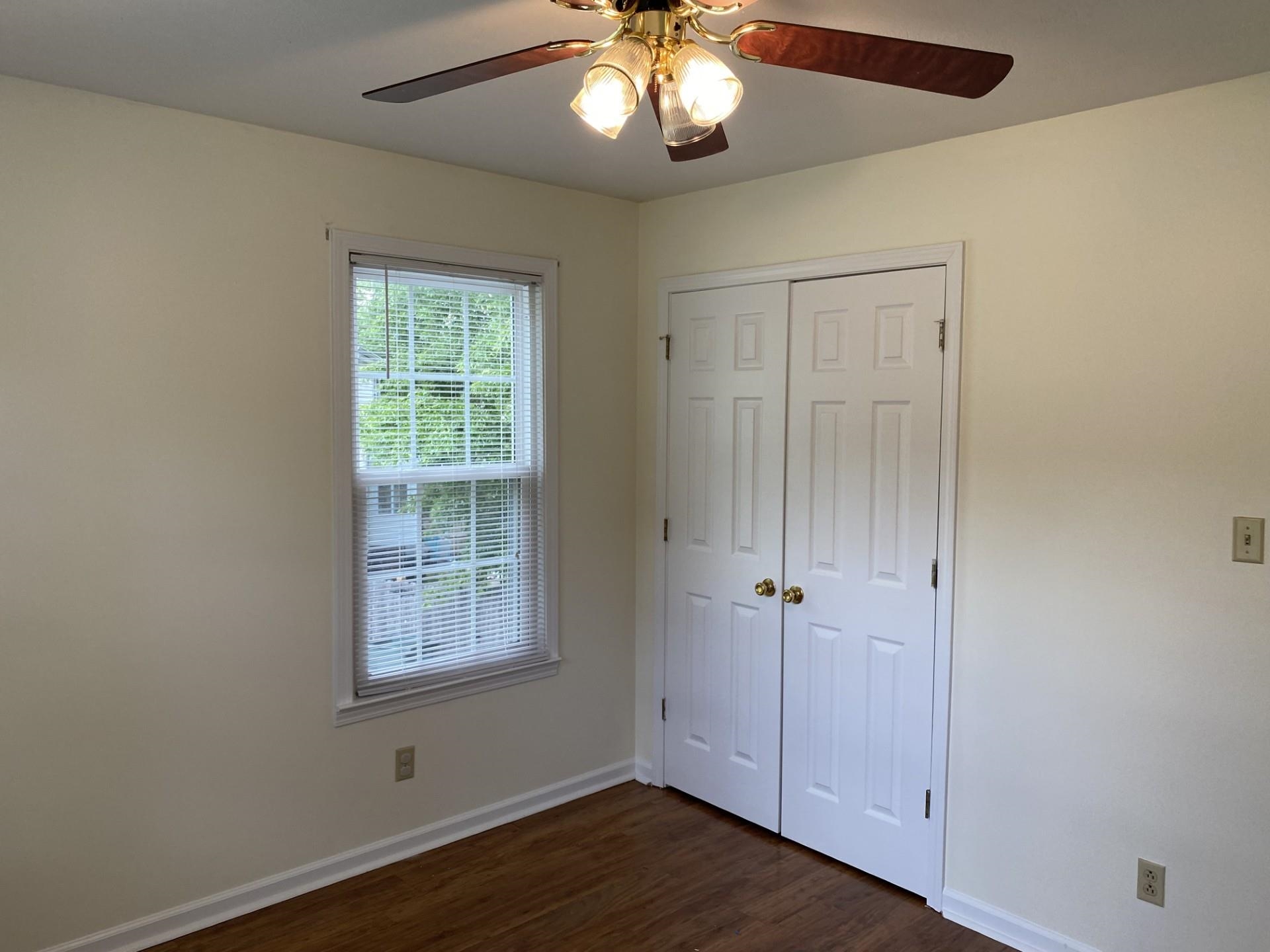 81 Candlewick Drive Jackson, TN 38305 - Photo 19 of 30 an empty room with wooden floor and windows