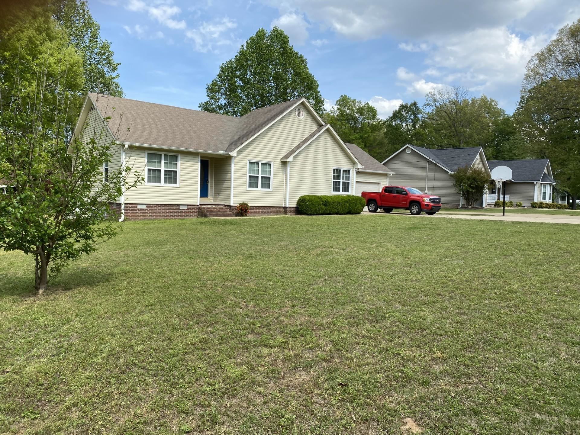 81 Candlewick Drive Jackson, TN 38305 - Photo 2 of 30 a view of a house with a yard and garage