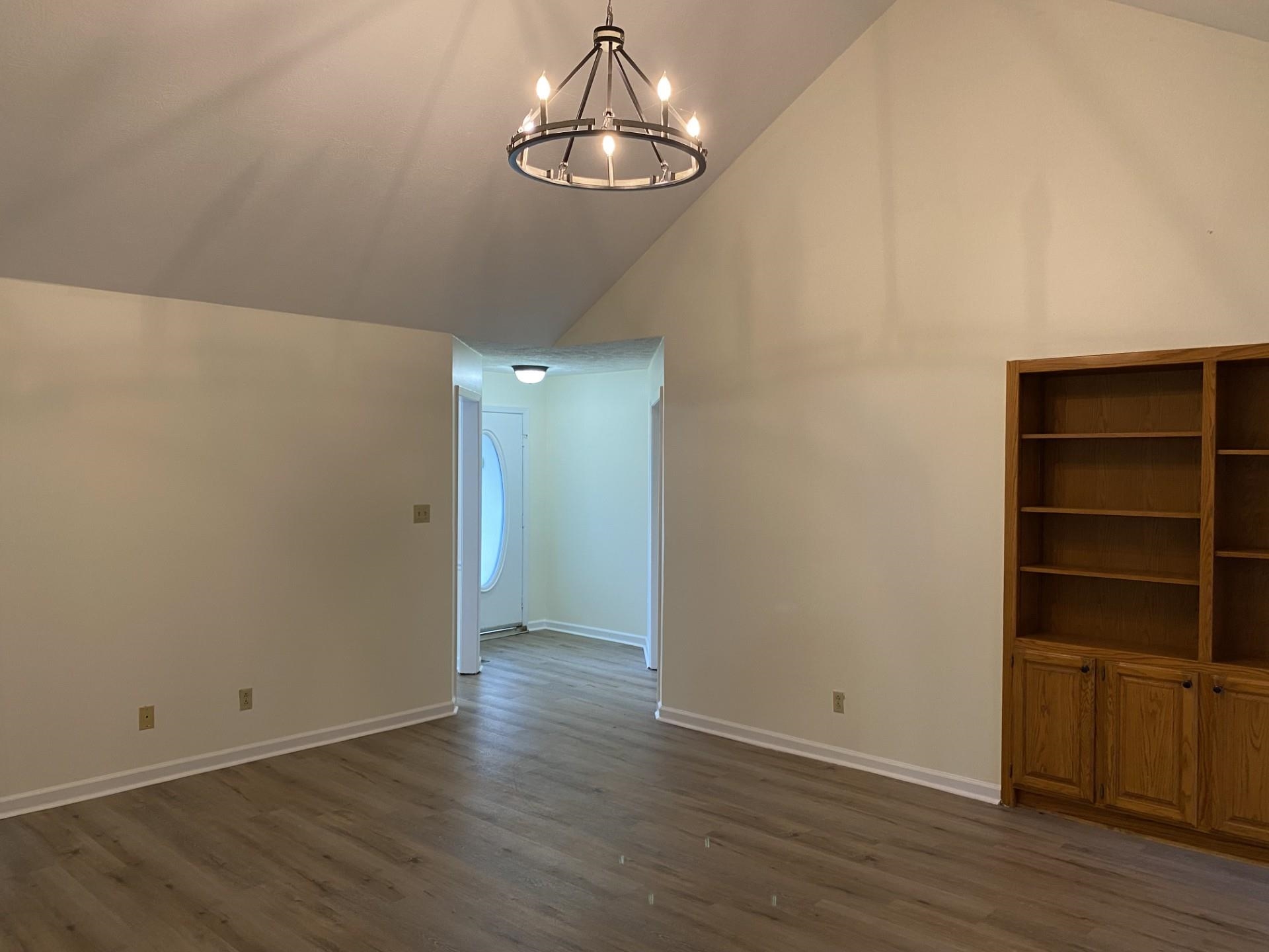 81 Candlewick Drive Jackson, TN 38305 - Photo 10 of 30 a view of an empty room with wooden floor and a window
