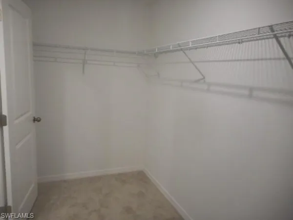 a view of a room with racks on the wall