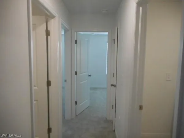 a bathroom with a shower and a glass door