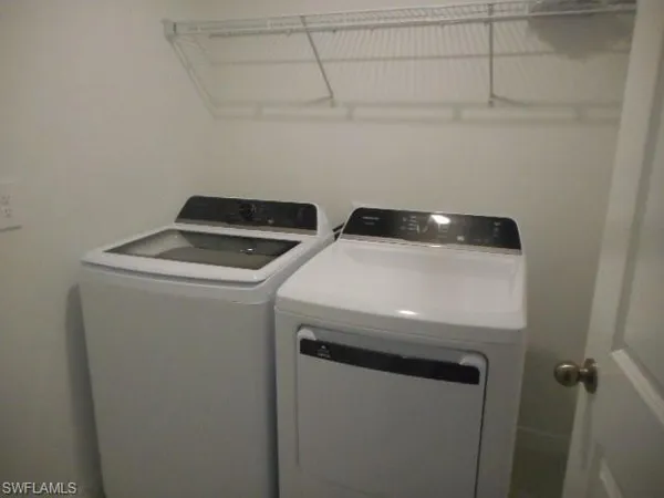 a utility room with dryer and washer