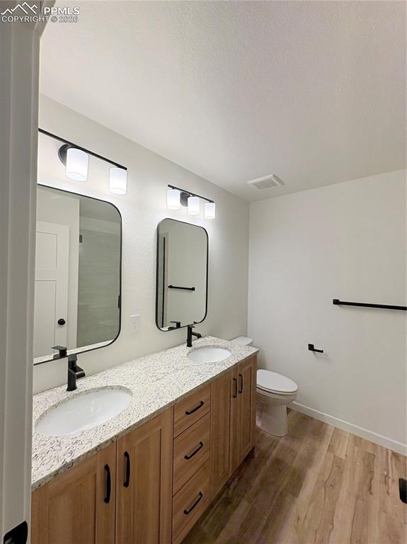 834 Keystone Loop Canon City, CO 81212 - Photo 4 of 14 a bathroom with a granite countertop sink mirror and toilet