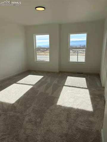 an empty room with windows
