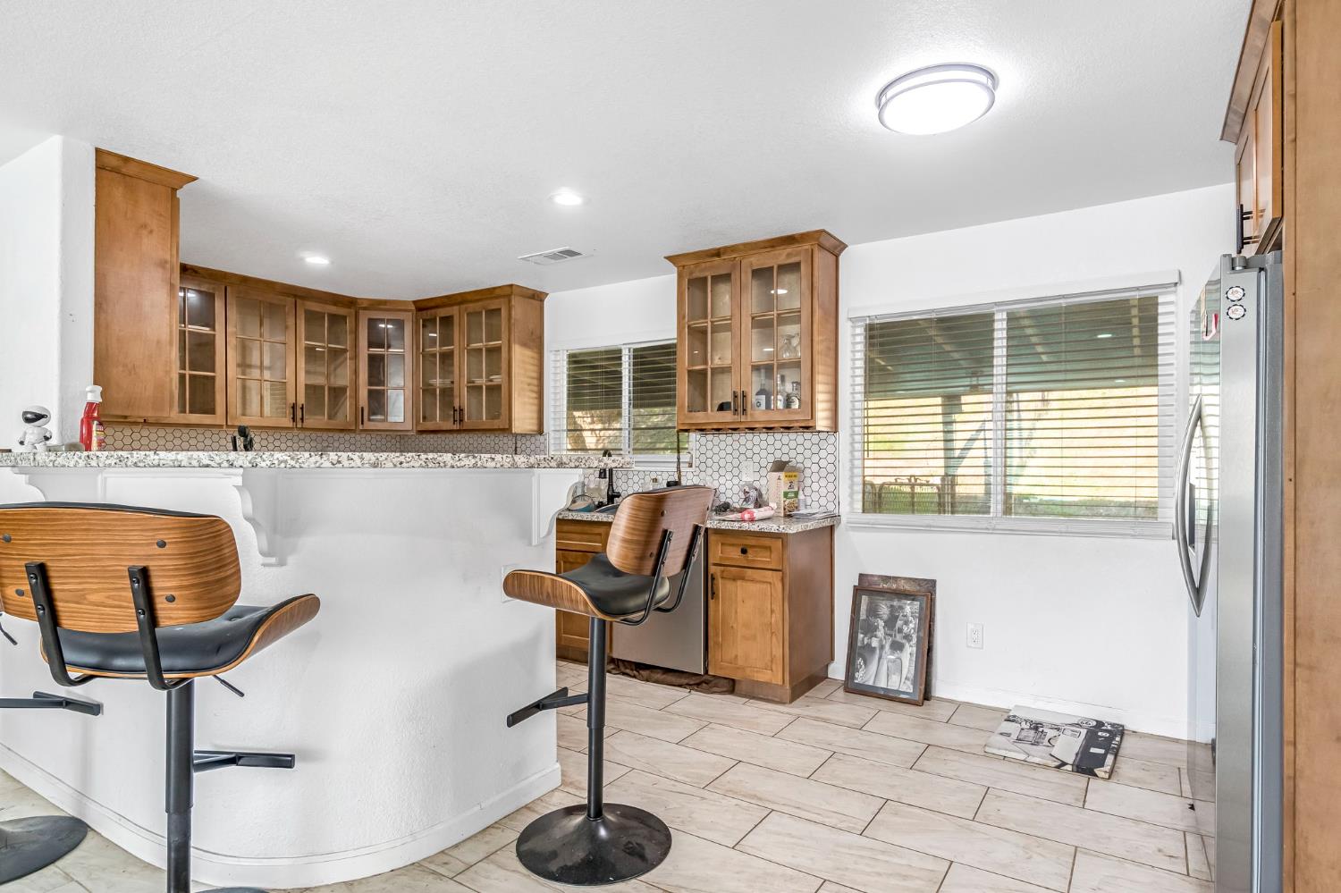 34045 George Smith Road Squaw Valley, CA 93675 - Photo 12 of 37 a view of a kitchen with kitchen island granite countertop a refrigerator and a sink