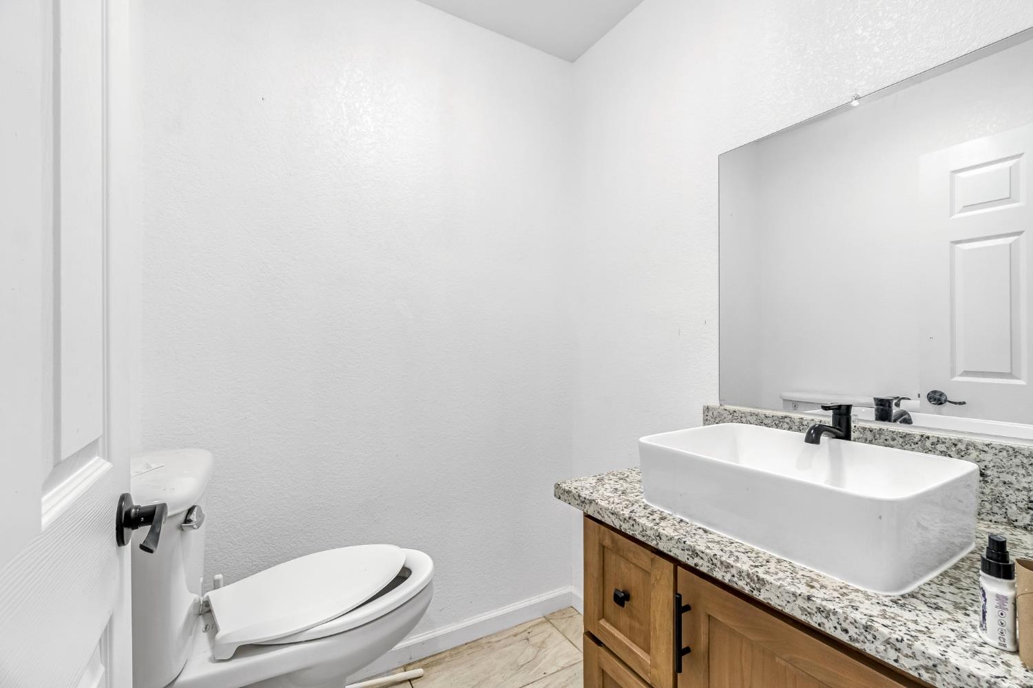 34045 George Smith Road Squaw Valley, CA 93675 - Photo 16 of 37 a bathroom with a granite countertop sink and a mirror