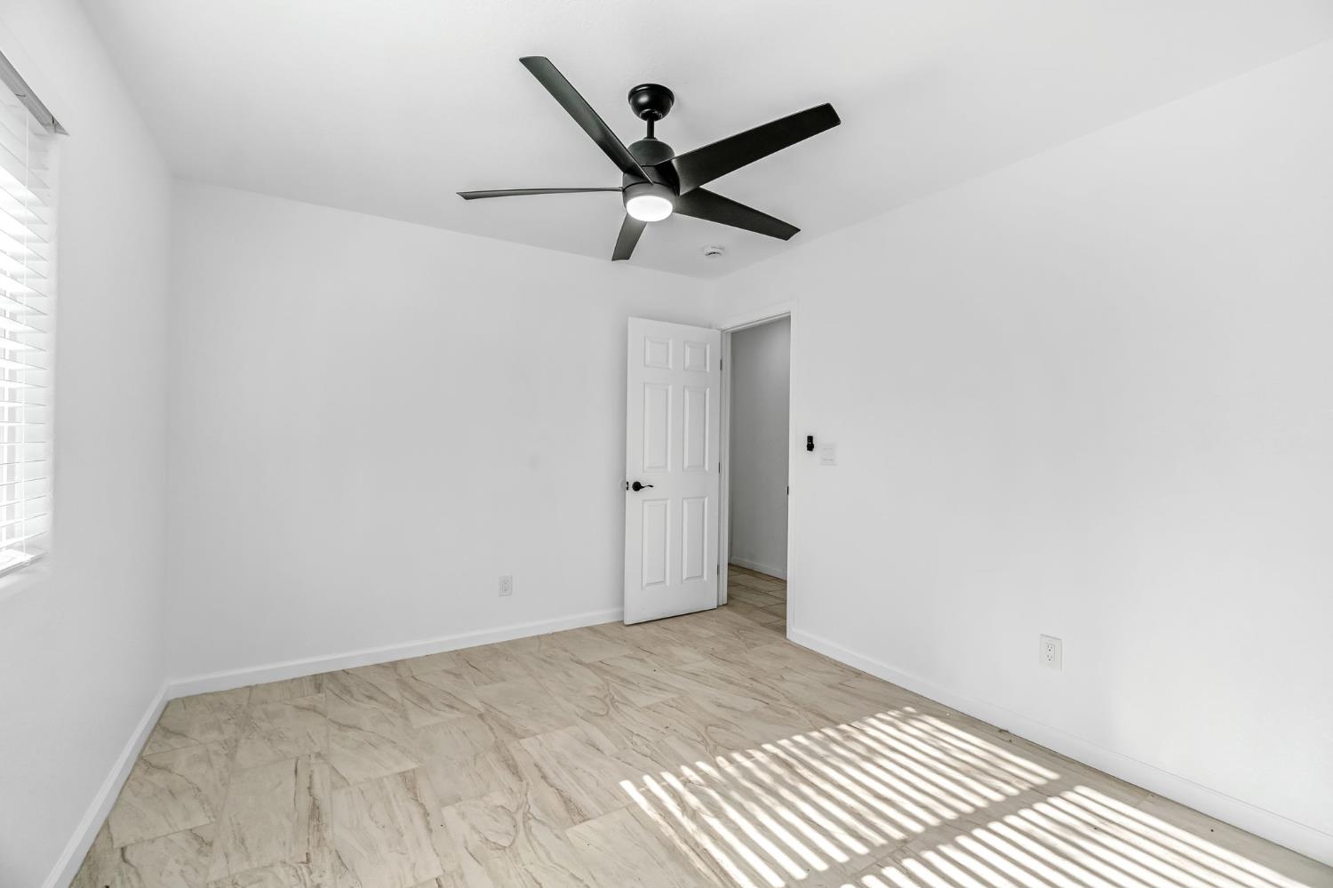 34045 George Smith Road Squaw Valley, CA 93675 - Photo 18 of 37 a view of a room with a ceiling fan and wooden floor