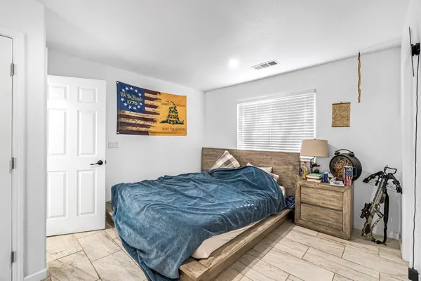 a bedroom with a bed and a cabinets