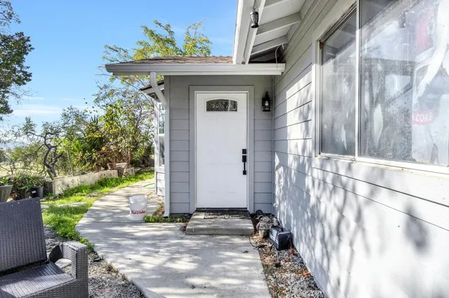 a view of a house with a small yard