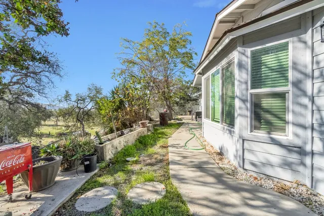 a view of house with backyard
