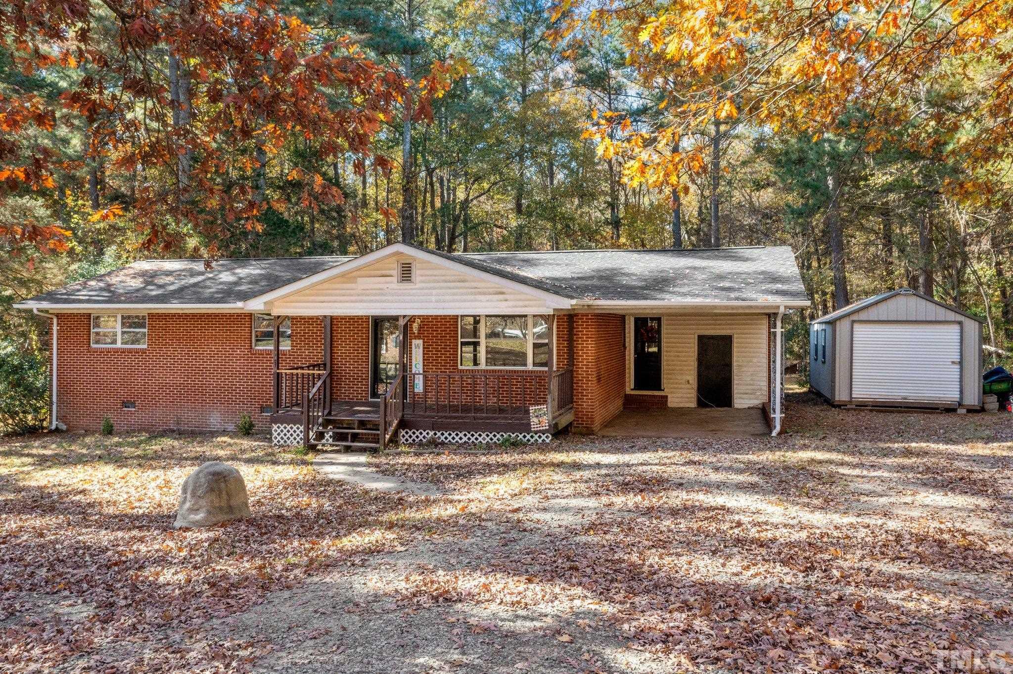 801 Avalon Road Durham, NC 27704 - Photo 1 of 30 a backyard of a house with yard and outdoor seating